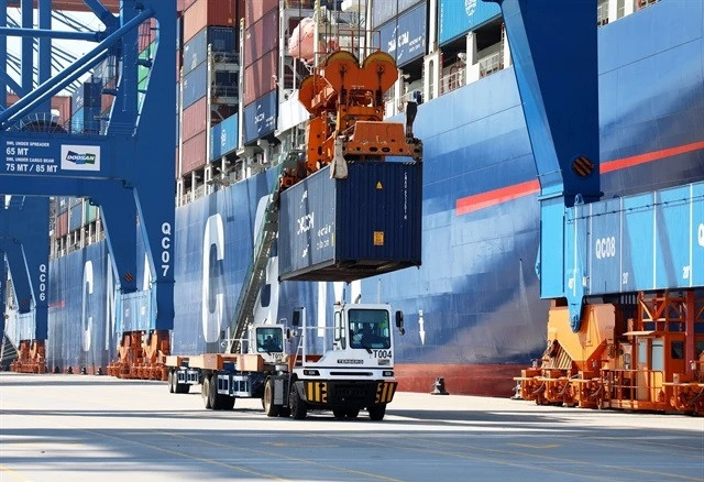 Containers being loaded at Gemalink International Port in Ba Ria - Vung Tau province (Photo: VNA) Ministry urges attention to food safety regulations when exporting to Singapore -0