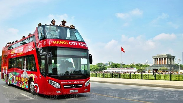 Foreign tourists join a double-decker bus tour around Hanoi (Photo: VNA) Vietnamese destinations honoured in TripAdvisor’s 2024 traveler choice awards -0