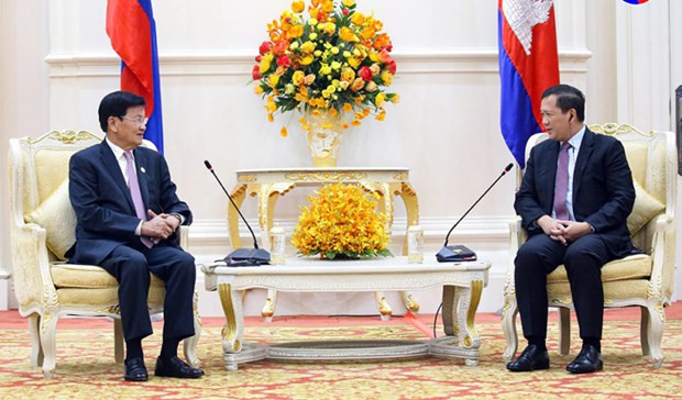 At the meeting between Lao and Cambodian leaders. (Photo: khmertimeskh.com) Cambodia, Laos vow to boost bilateral ties -0